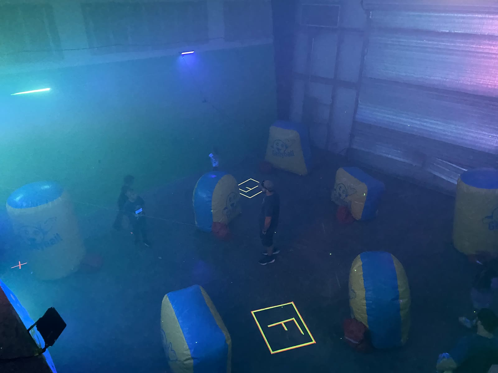 Blacklight GellyBall arena with inflatable bunkers