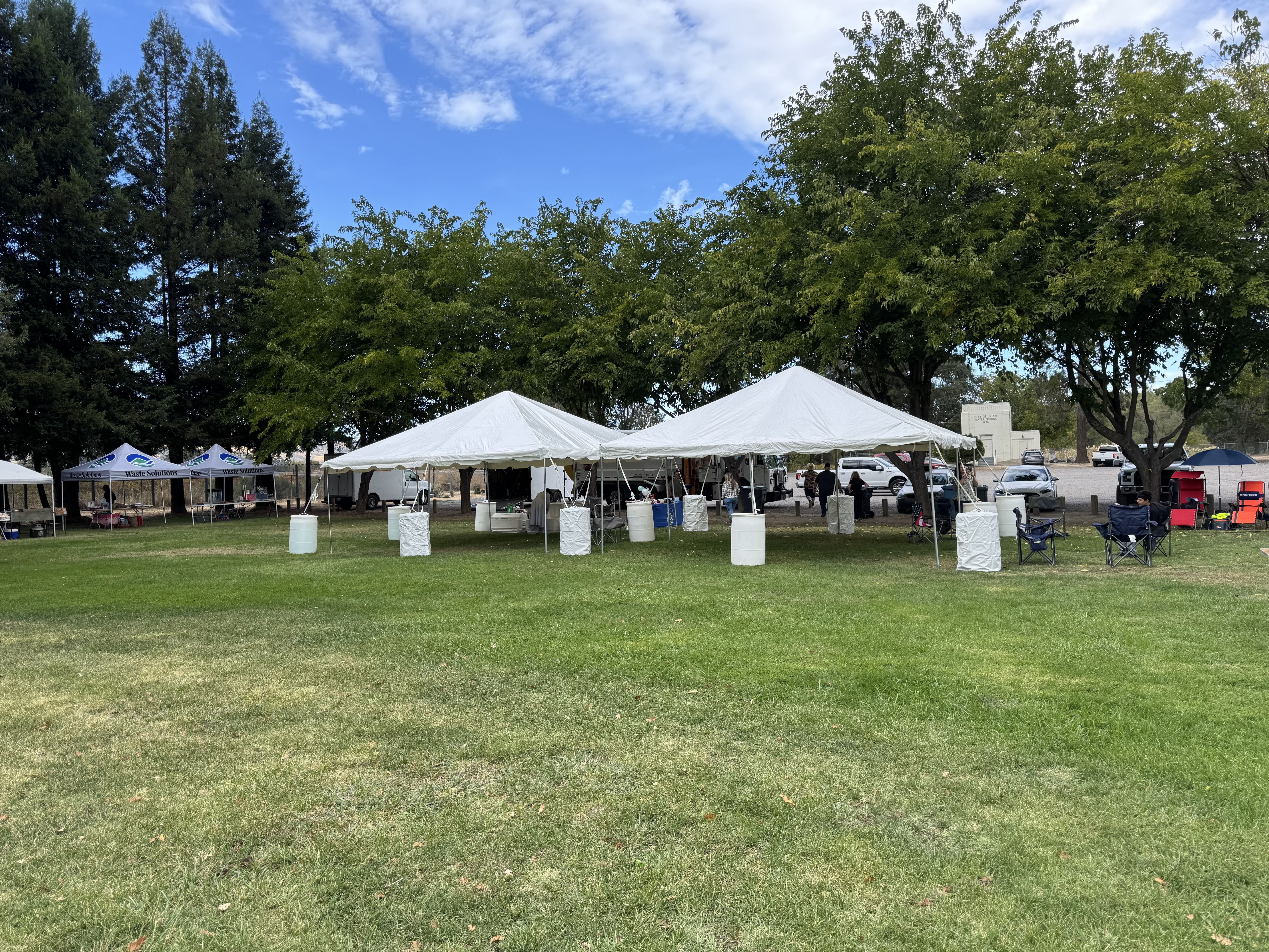 White event tents and seating at a fall festival